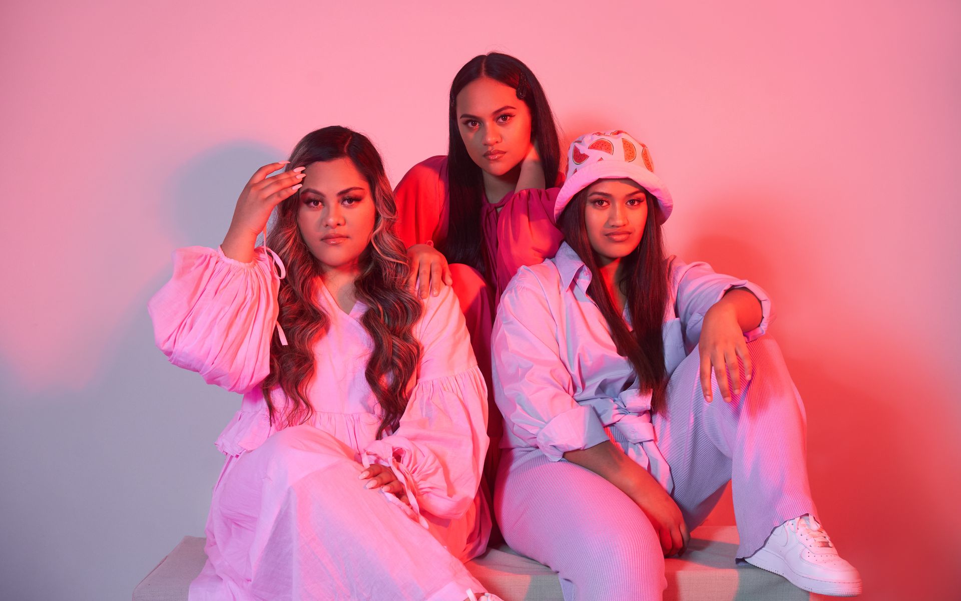 Anastasia, Rosetta and T-R3X of A.R.T in pink studio light
